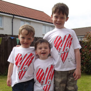 Jack, Toby & Noah wearing Edinburgh Children's Hospital Charity (previously The Sick Kids Friends Foundation) t–shirts that Jack designed